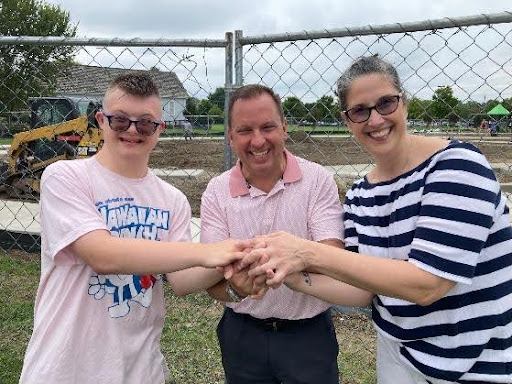 Paul and a member of the Inclusive Playground Committee and her son, visiting the future site of the Inclusive Playground.